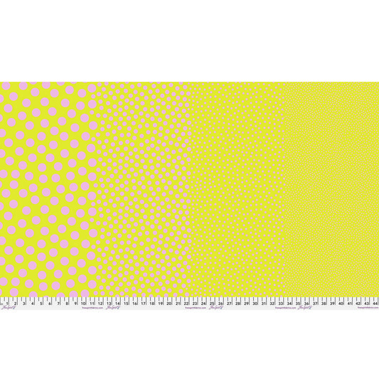 Stones in Cherry Limeade by Tula Pink — full-width fabric view showing four dot sizes.