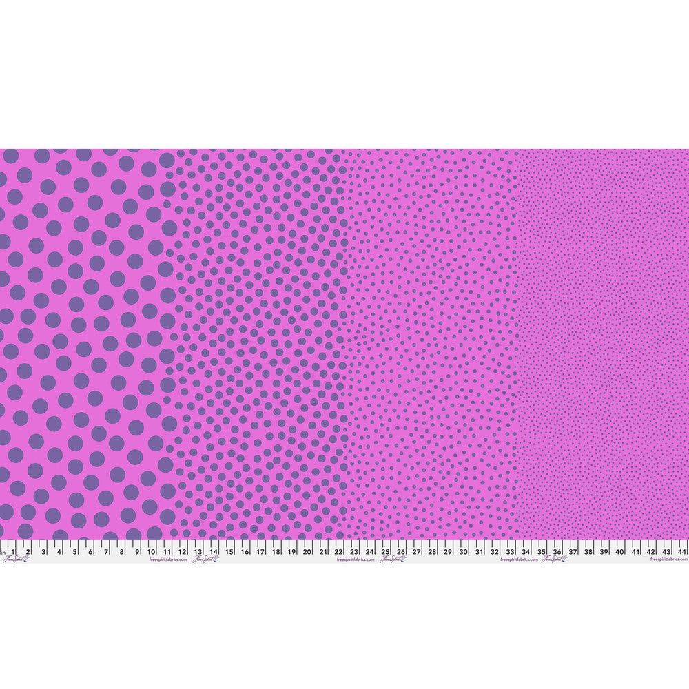Stones in Grape Crush by Tula Pink — full-width fabric view showing four dot sizes.