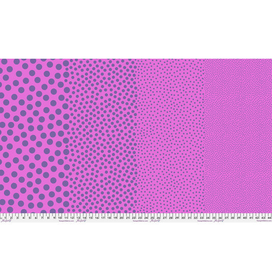 Stones in Grape Crush by Tula Pink — full-width fabric view showing four dot sizes.