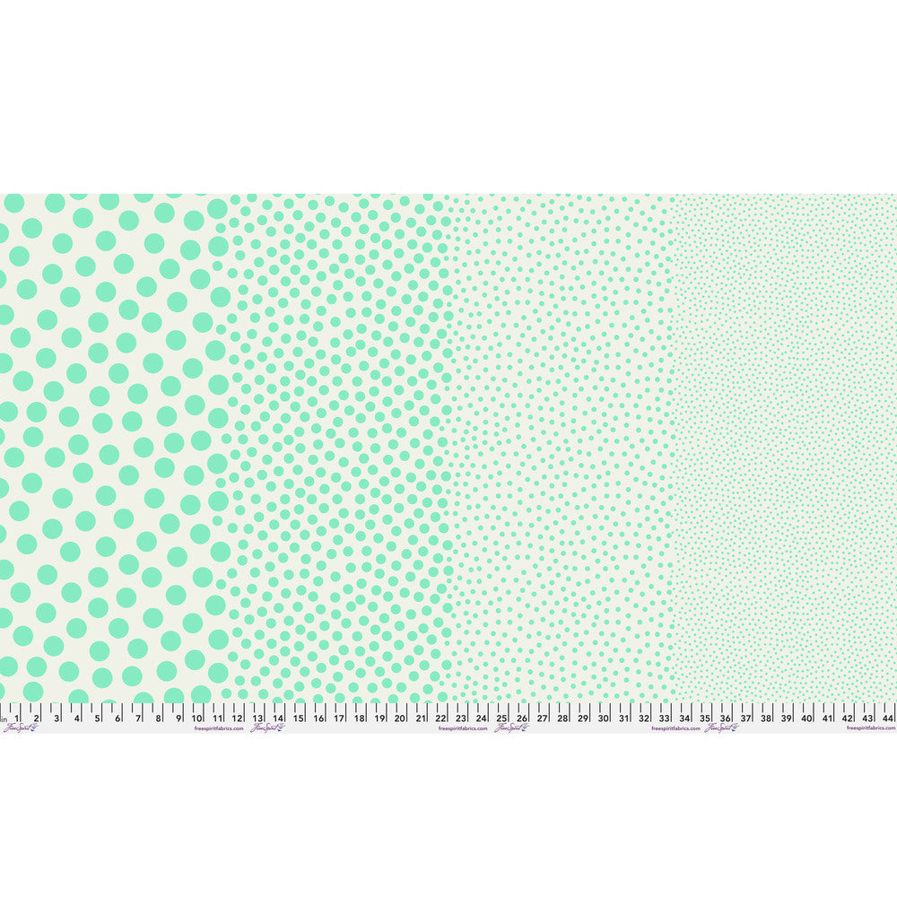 Stones in Oasis by Tula Pink — full-width fabric view showing four dot sizes.
