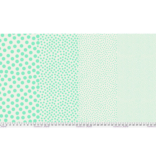 Stones in Oasis by Tula Pink — full-width fabric view showing four dot sizes.