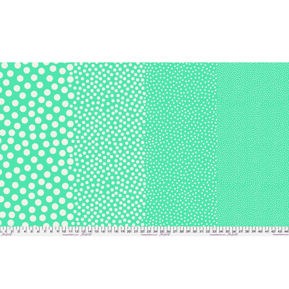 Stones in Patina by Tula Pink — full-width fabric view showing four dot sizes.
