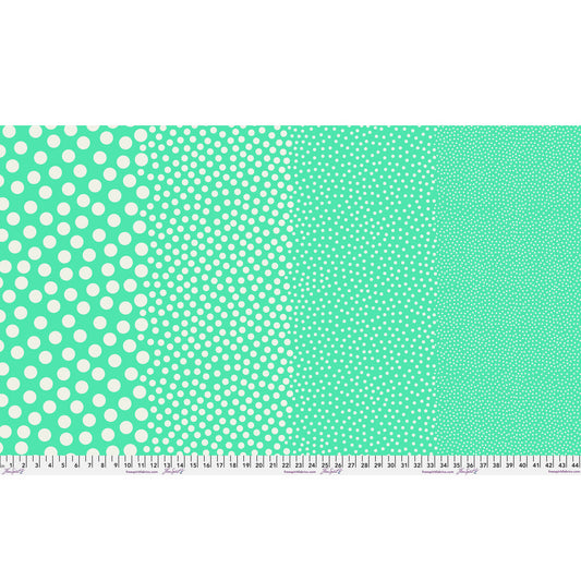 Stones in Patina by Tula Pink — full-width fabric view showing four dot sizes.