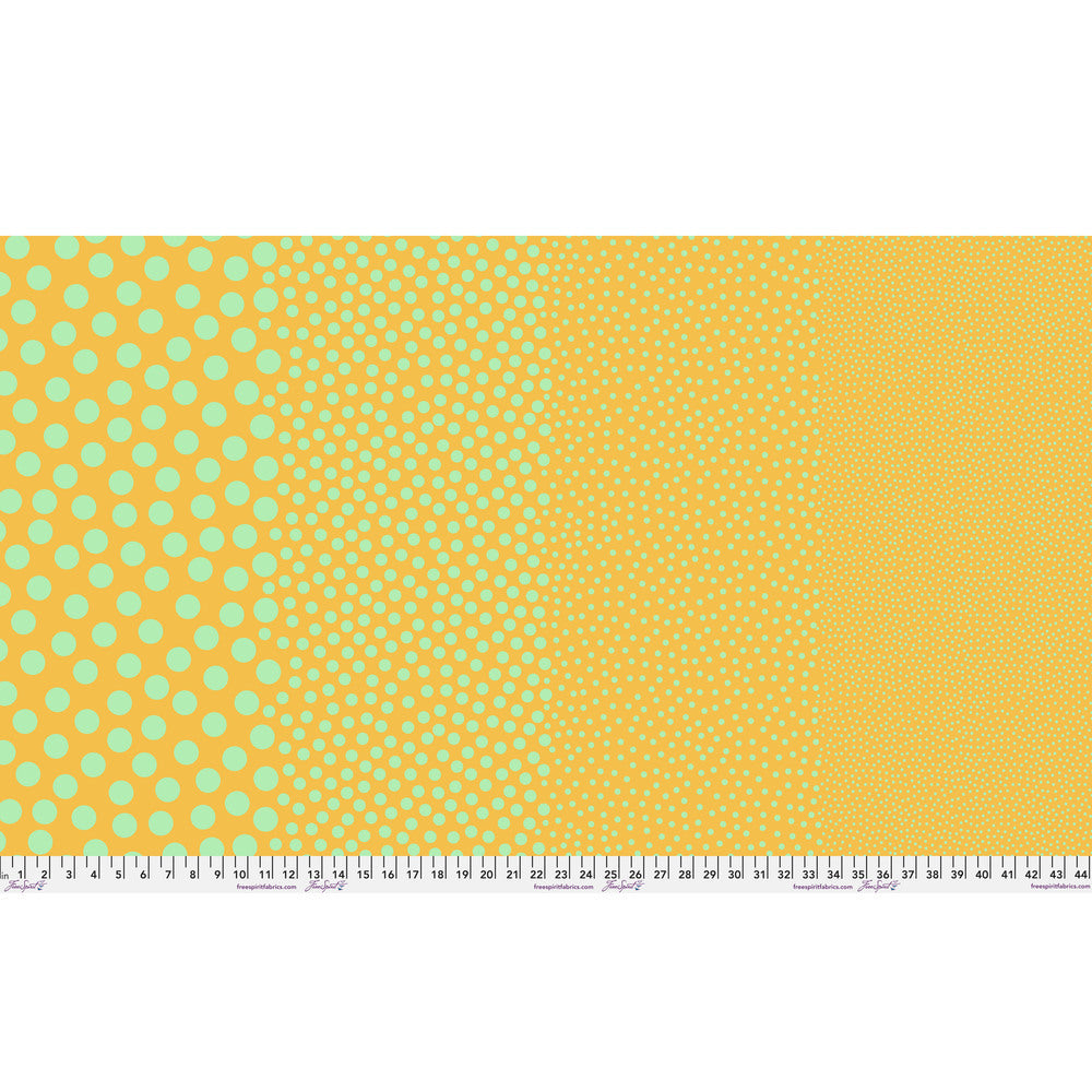 Stones in Sunflower by Tula Pink — full-width fabric view showing four dot sizes.