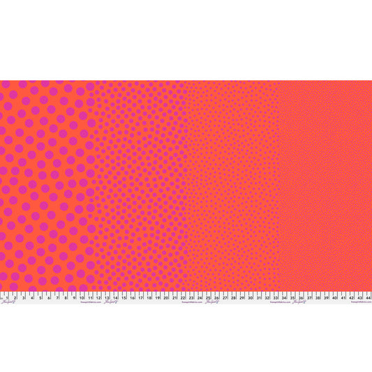 Stones in Tomato by Tula Pink — full-width fabric view showing four dot sizes.