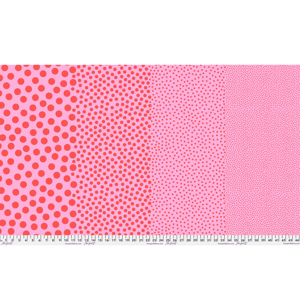 Stones in Watermelon by Tula Pink — full-width fabric view showing four dot sizes.
